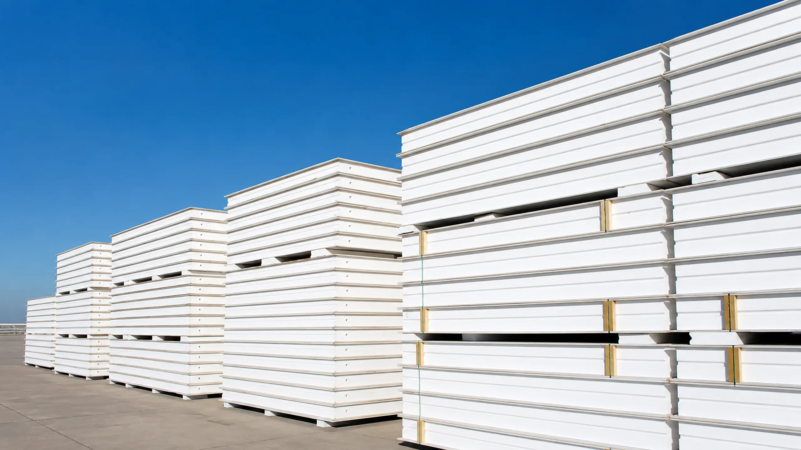 Stacks of finished Titanwall MGO SIP panels ready for shipping